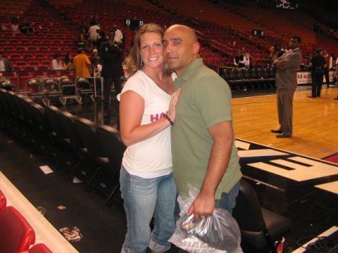 1991 Ford Bronco - A couple smiles for the camera while attending a basketball game in an arena.