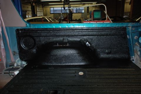 1996 Ford Bronco - Truck bed liner application in progress, showing the textured black coating.