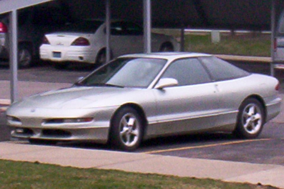 Silver Ford Probe coupe parked in a parking lot