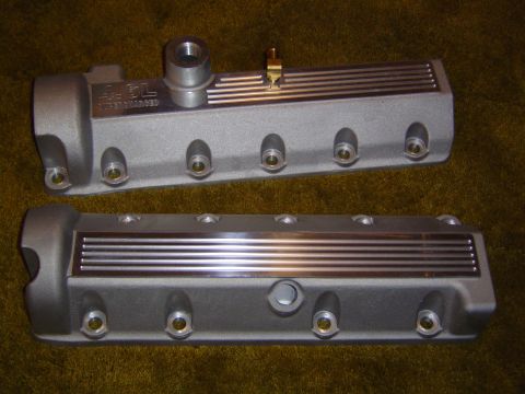 1995 Ford Thunderbird - Two engine valve covers are shown, one labeled '4.6L SUPERCHARGED', against a textured background.