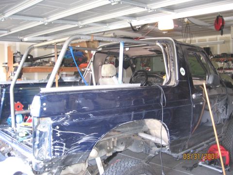 1994 Ford Bronco - Custom roll cage installation in progress on a 1994 Ford Bronco.