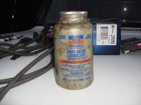 1983 Ford Bronco - i put some of the Anit-size on the plug threads. this will keep the plugs from rusting to the head and allow easy swap next time.