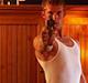 1995 Ford Probe - A man points a gun directly at the camera in this indoor scene.