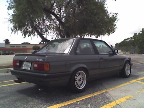 1989 BMW 3 Series - This 1989 BMW 3 Series coupe features aftermarket wheels and a spoiler.