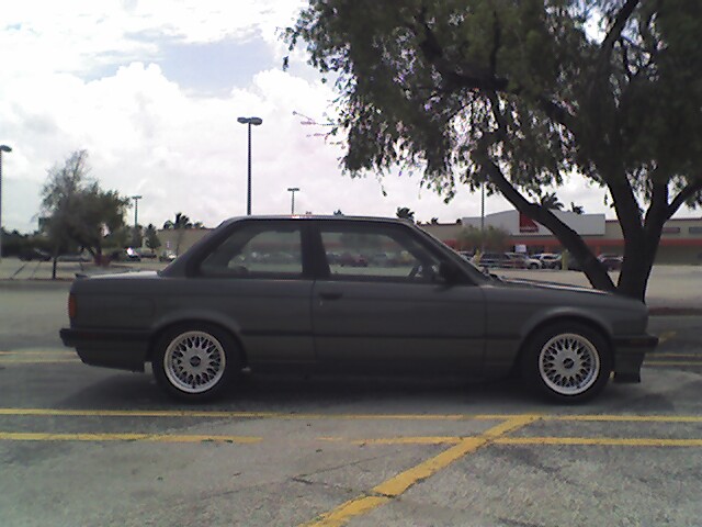 Side view of a gray 1989 BMW 3 Series coupe parked in a lot