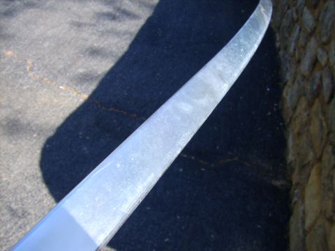1982 Ford Crown Victoria LTD - A close-up of a chrome trim piece, likely from a car, showing wear and tear.
