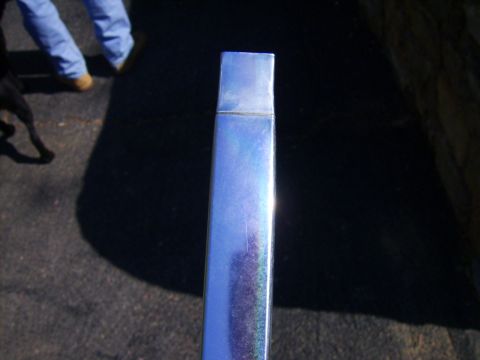 1982 Ford Crown Victoria LTD - A close-up of a chrome trim piece with blue metallic paint flecks is visible.