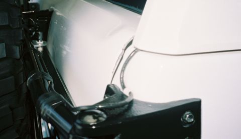 1996 Ford Bronco - Close-up of the spare tire and its mounting bracket on a 1996 Ford Bronco.