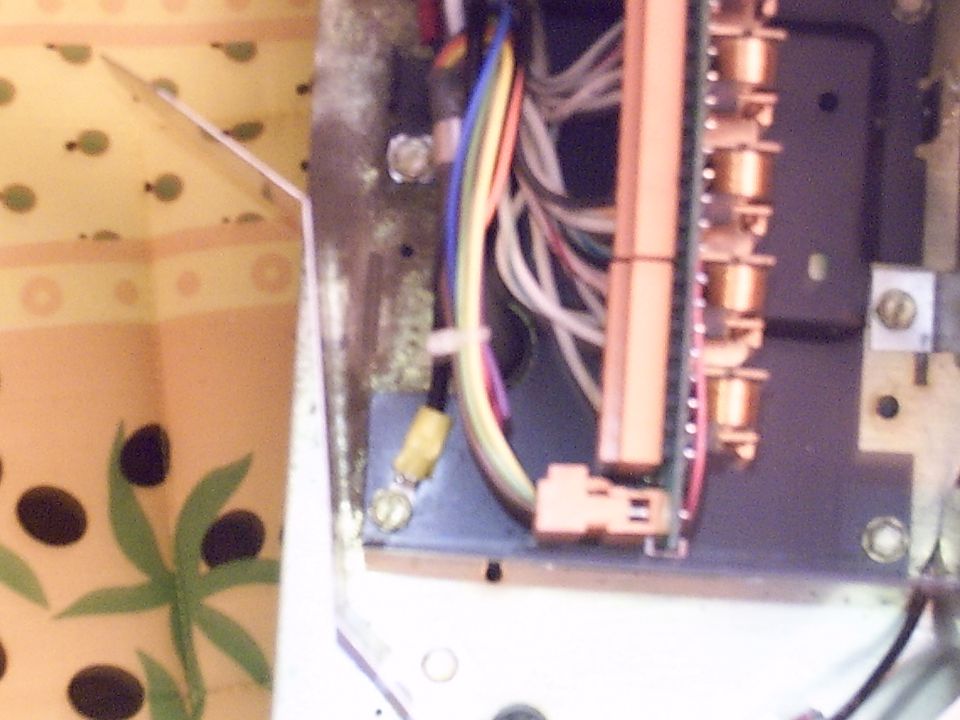 Close-up of electrical wiring and connectors with a "SUPERMOTORS" logo