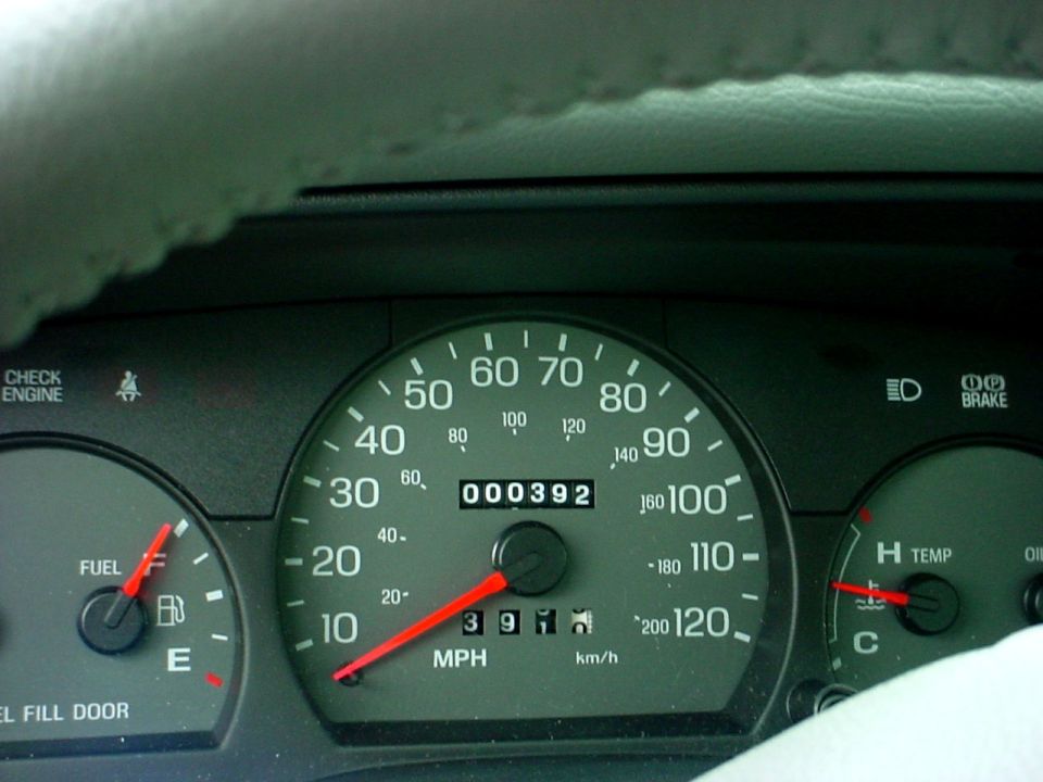 Dashboard gauges with odometer reading 000392 and speedometer up to 120 MPH