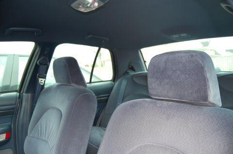 1985 Mercury Grand Marquis - Interior view of blue velour headrests and seats, with a Supermotors.net watermark visible.