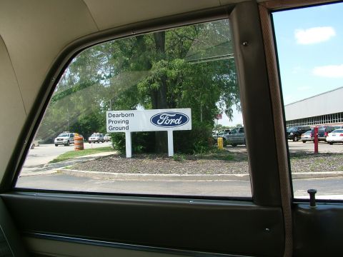 1972 Ford Ranchero - View from inside a vehicle shows a sign for the Dearborn Proving Ground with other cars visible in the background.