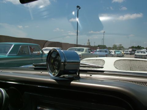1972 Ford Ranchero - A close-up of a car's dashboard, an RPM gauge and a view of other vehicles parked outside.