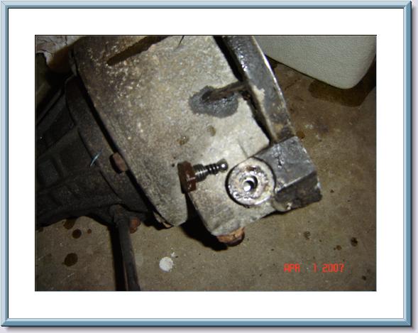 Close-up of transfer case housing on garage floor, dated April 2007