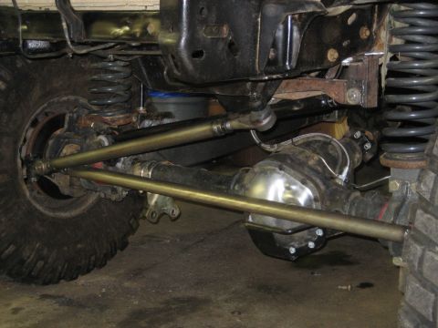 1990 Ford Bronco - This image shows the underside of a vehicle, focusing on the steering and suspension system, including the differential and springs.