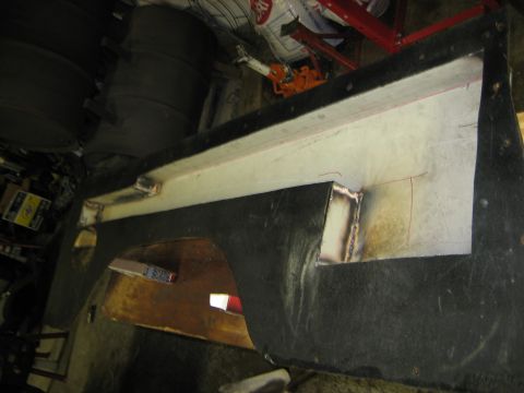 1990 Ford Bronco - A car fender part is shown with visible welding and reinforcement work.