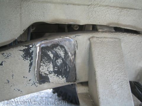 1987 Suzuki Samurai - Close-up view of a welded patch on a vehicle's frame, indicating a modification or repair.