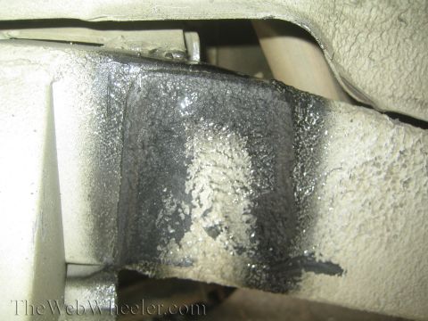 1987 Suzuki Samurai - Close-up view of the vehicle's frame, showing applied undercoating.