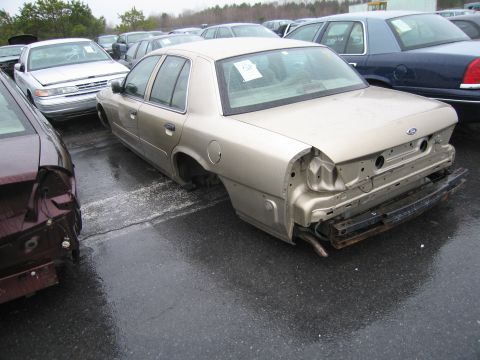 1991 Ford LTD Crown Victoria - This 1991 Ford Crown Victoria LTD is missing its rear bumper and appears to be in a junkyard.