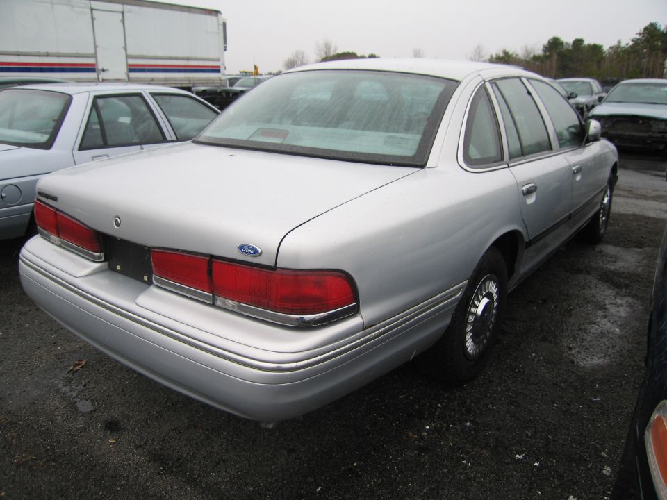 Silver 1991 Ford Crown Victoria LTD rear 3/4 view
