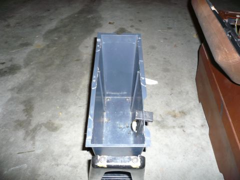 1975 Ford Ranchero - A plastic storage bin is shown, possibly for a vehicle's interior, resting on a stand.
