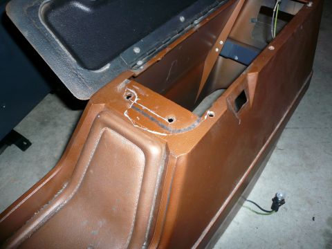1975 Ford Ranchero - Close-up of a vehicle's center console, likely removed for modification or repair.