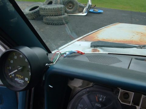 1983 Ford Ranger - Interior view of a vehicle's dashboard with an aftermarket tachometer and fuel gauge.