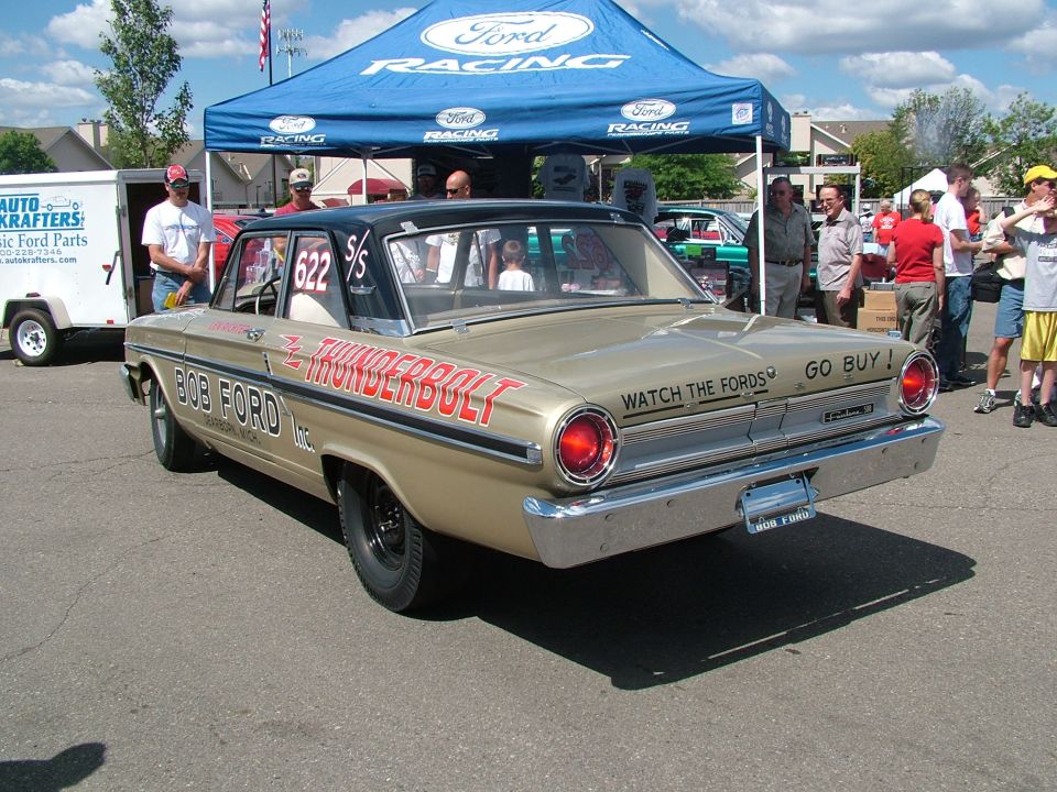 Gold 1963 Ford Ranchero with black roof and red 'Thunderbolt' lettering, viewed from rear