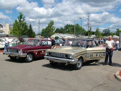 1972 Ford Ranchero - Two classic Ford Falcons, likely from the mid-1960s, parked at an outdoor event.