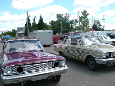 1972 Ford Ranchero - Two classic Ford cars, a Falcon and a Fairlane, are parked side-by-side at an outdoor event.