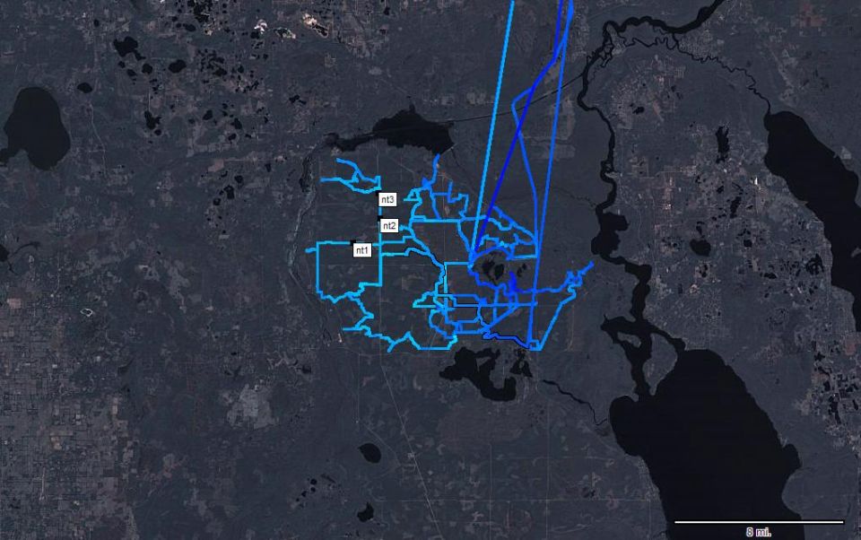 Satellite map screenshot with blue GPS route tracks; not a vehicle