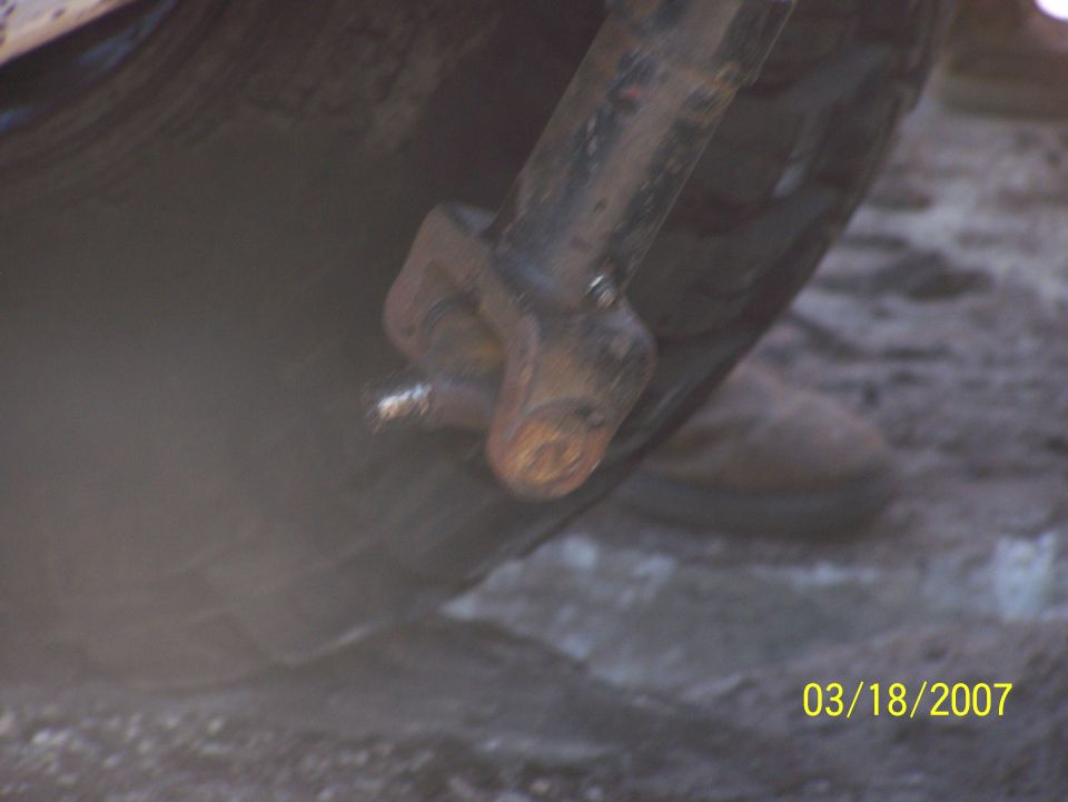 Close-up of rusty metal part on tire