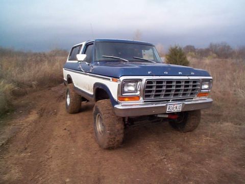 1978 Ford Bronco - This 1978 Ford Bronco is shown off-road with a two-tone paint scheme and lifted suspension.