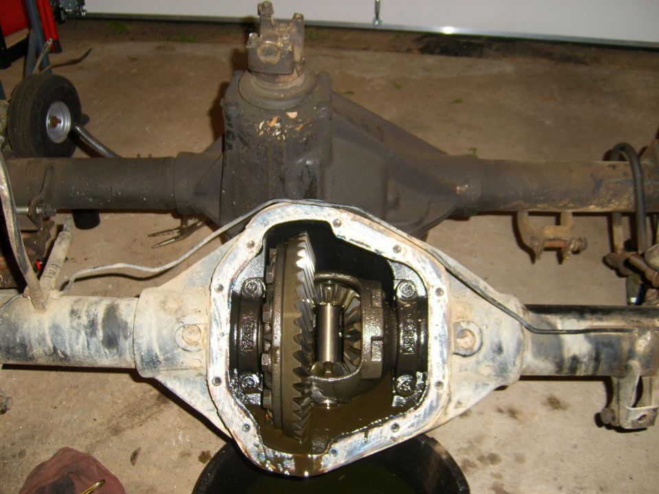 close-up of an open differential housing with gears visible