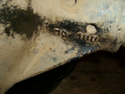 1994 Ford Bronco - Close-up of a vehicle part showing stamped numbers 70-180.