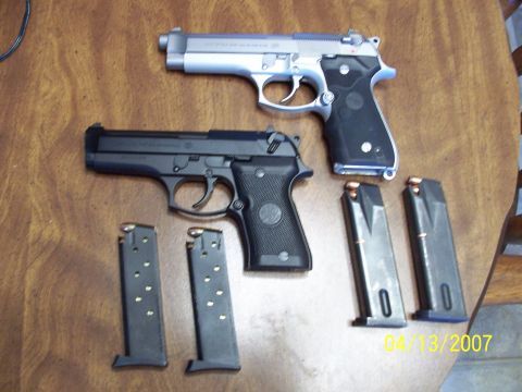 2000 Nissan Xterra - Two handguns and multiple magazines are laid out on a wooden table, with a date stamp of 04/13/2007 visible.