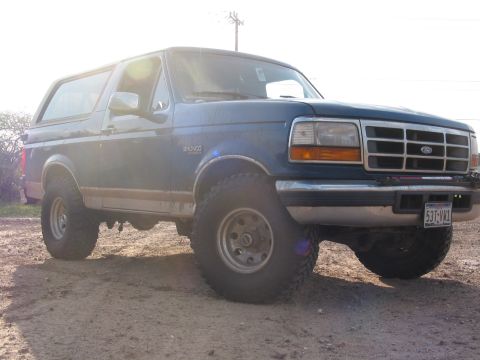 1996 Ford Bronco - This 1996 Ford Bronco is shown in a three-quarter front view, highlighting its iconic body style.