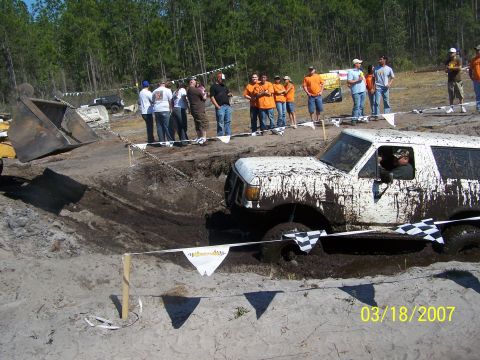 1989 Ford Bronco - This vehicle is covered in mud while navigating an off-road course.