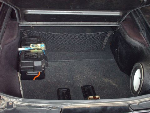 1995 Ford Probe - The trunk of a vehicle shows a battery box and a subwoofer, with a date stamp of 01/30/2005.