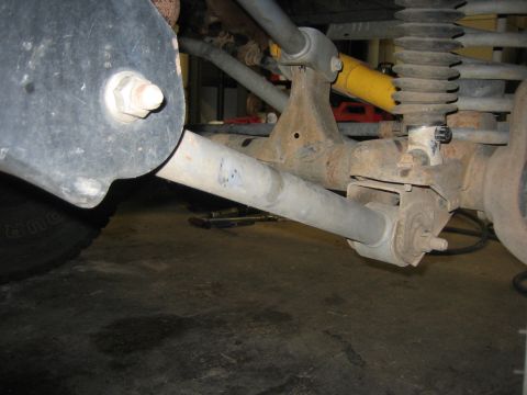 2001 Jeep Wrangler - Undercarriage view of a vehicle's rear suspension system, showing the axle and related components.