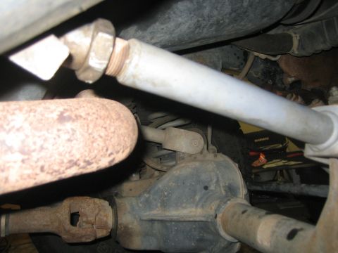 2001 Jeep Wrangler - Close-up view of the underside of a vehicle, revealing mechanical parts and suspension.