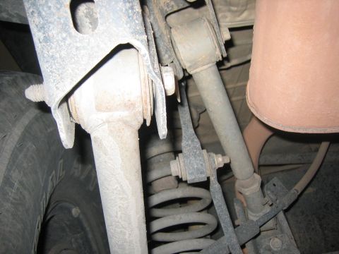 2001 Jeep Wrangler - Undercarriage view of a vehicle's rear suspension system, showing springs and linkages.