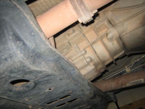 2001 Jeep Wrangler - The photo shows the underside of a vehicle, focusing on the transmission and exhaust components.