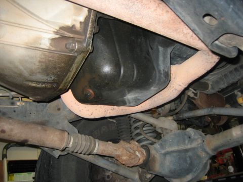 2001 Jeep Wrangler - A close-up view of the undercarriage reveals various mechanical parts and exhaust systems.
