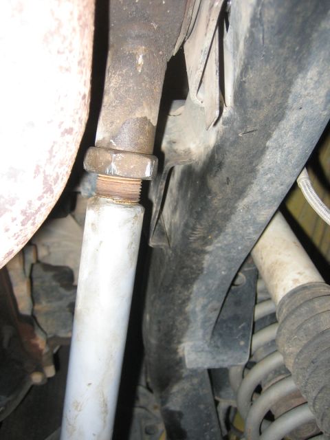 2001 Jeep Wrangler - Underside view of vehicle's exhaust system and suspension components, showing a bolted connection.