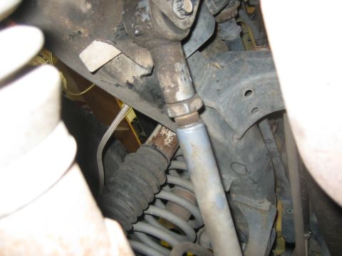 2001 Jeep Wrangler - Close-up view of the mechanical components of a vehicle's undercarriage.
