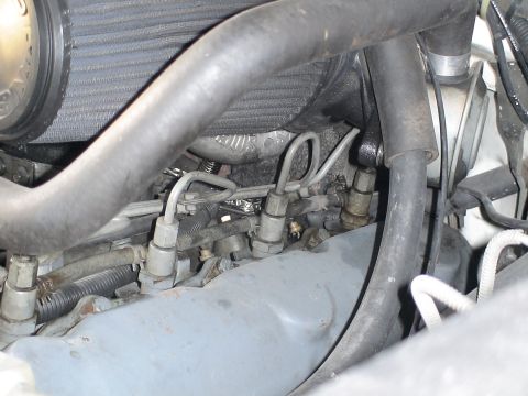 1993 Ford C-350 (Centurion Conversions) - Detail of fuel injection lines and components on a diesel engine.