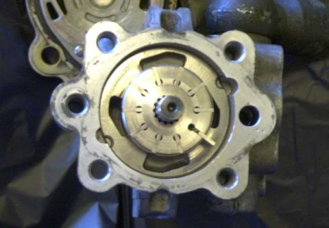 1997 Ford Taurus - The internal workings of a power steering pump are visible, showing the rotor and vanes.