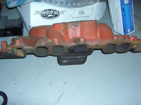 1974 Ford Bronco - Engine intake manifold shown with a "POWER SLOT" brake rotor box behind it.