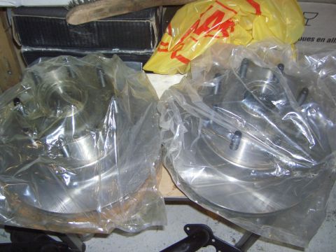 1974 Ford Bronco - New brake rotors and hubs are packaged for storage or installation.